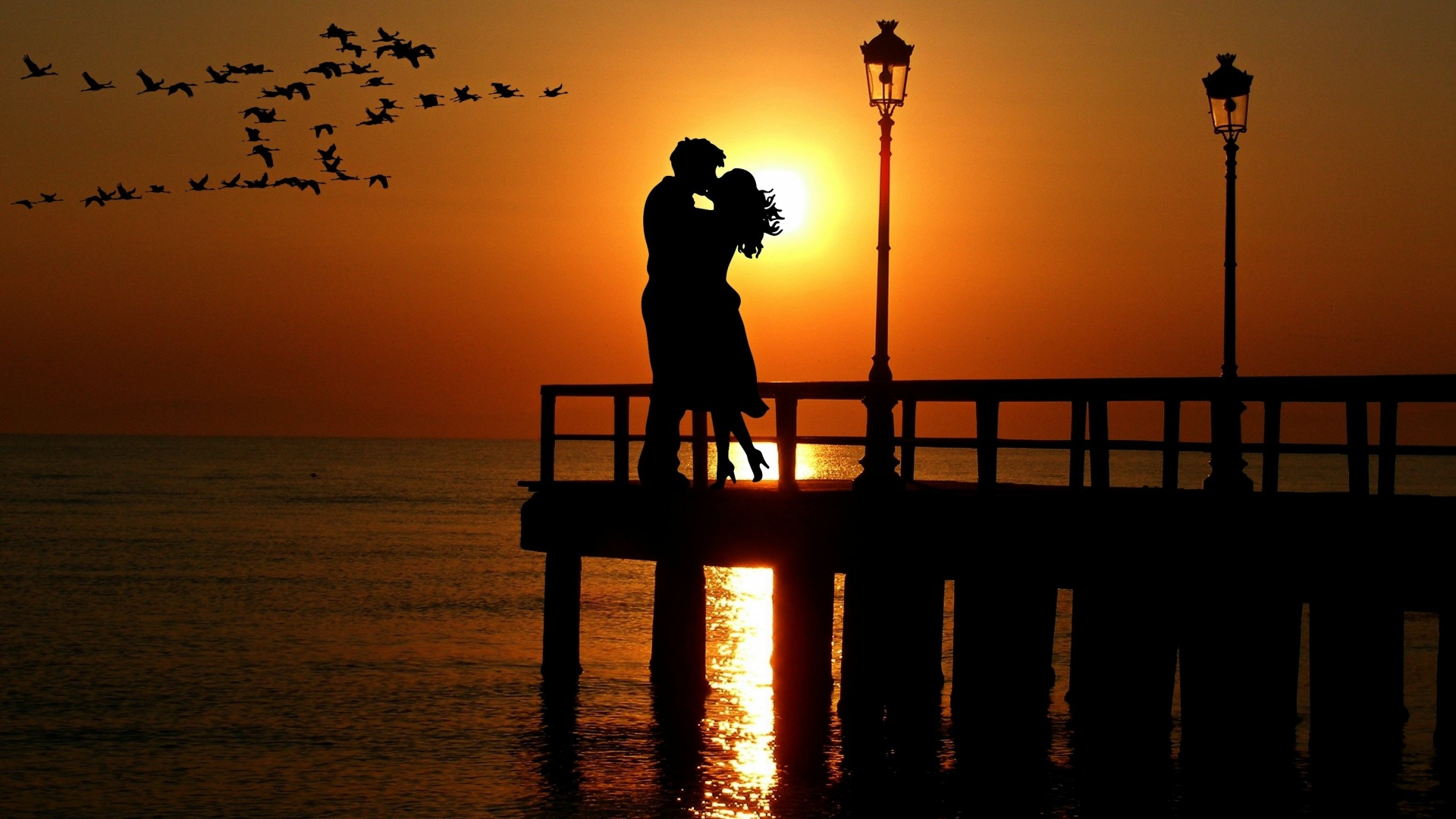 couple romantic kiss sunset silhouette photo