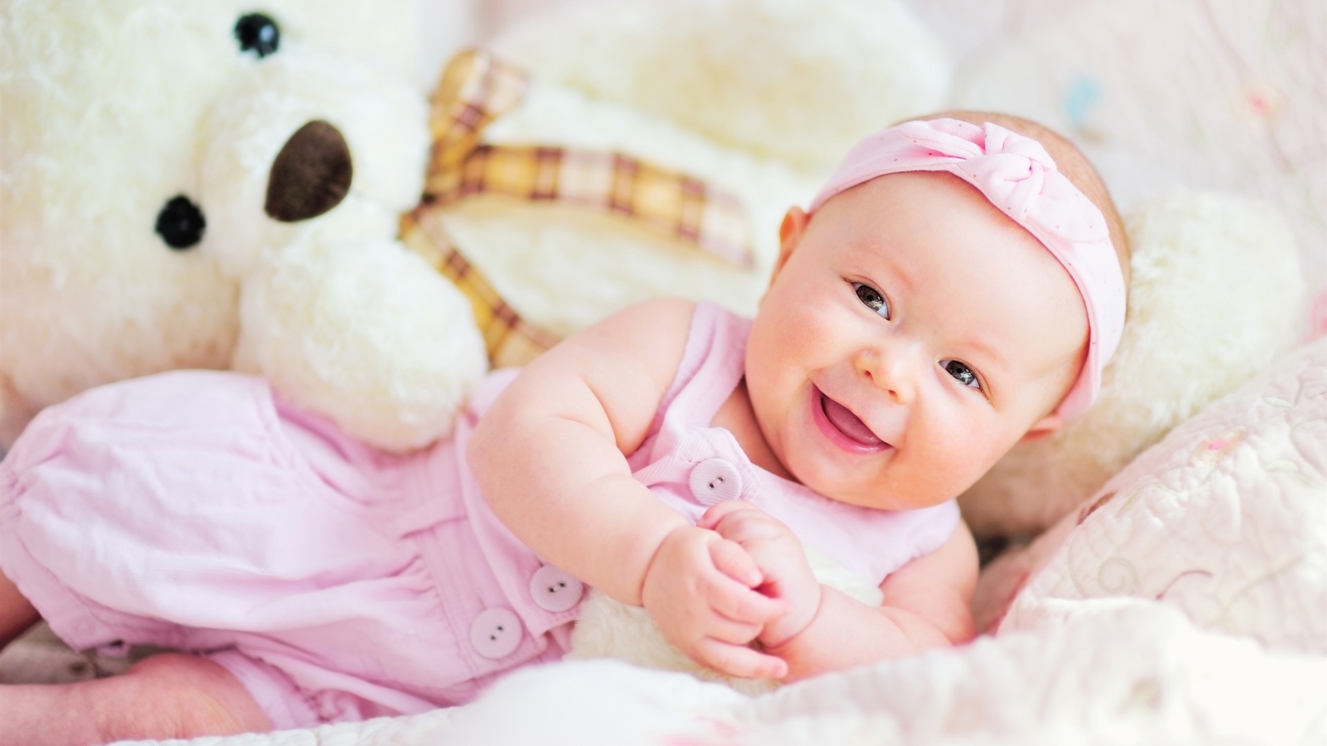 Cute baby with teddy bear photo