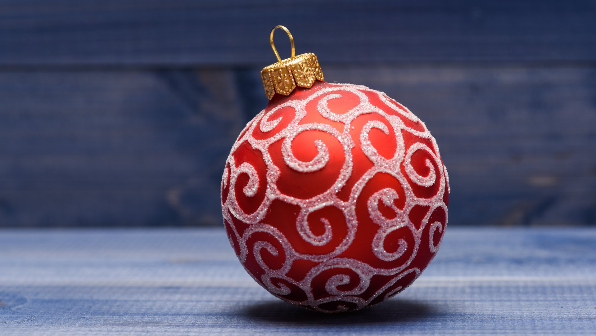 Christmas ball decoration on blue vintage wooden background