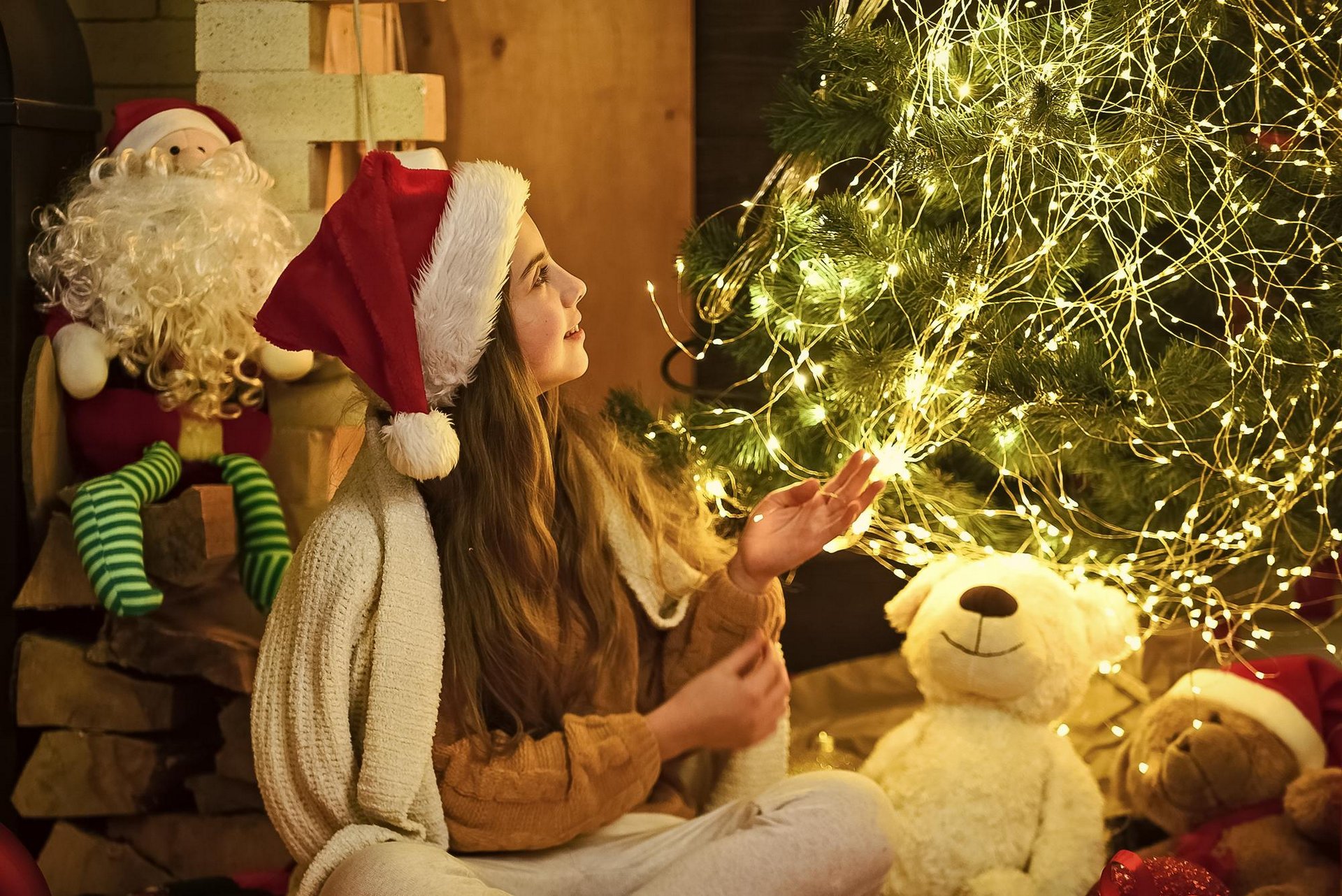 santa little girl christmas tree with lights  